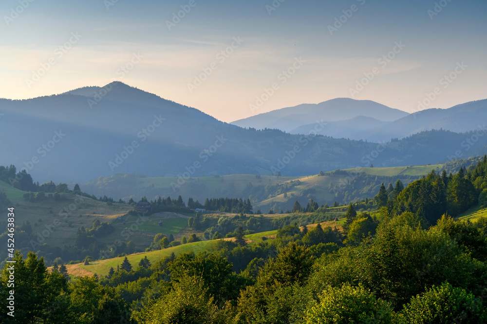 Poster Amazing mountain landscape with colorful vivid sunset on the cloudy sky