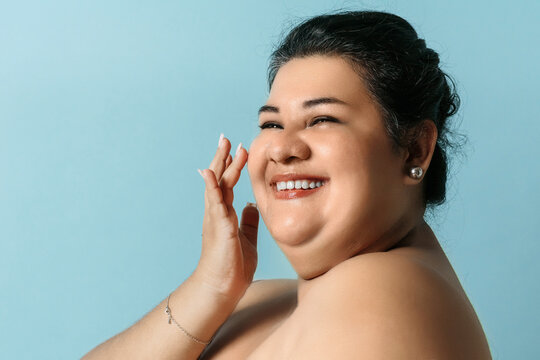 Plus size hispanic woman healthy skin. Smiling adult woman with skin care. - Powered by Adobe