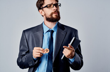 Cheerful business man in a suit of Bitcoin technology finance electronic wallet
