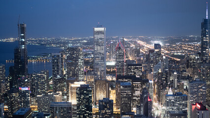Obraz premium The City of Chicago by night - view from above - CHICAGO, ILLINOIS - JUNE 12, 2019