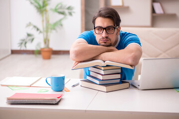 Young male student studying at home