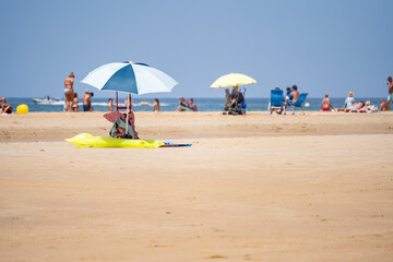 Beach umbrella on the sandy beach on the coast