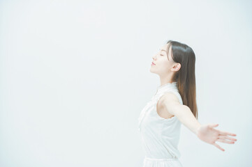 Young woman taking a deep breath