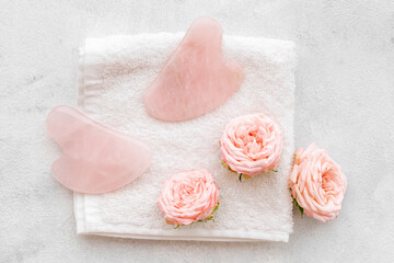 Face massage stone with roses for skin beauty care