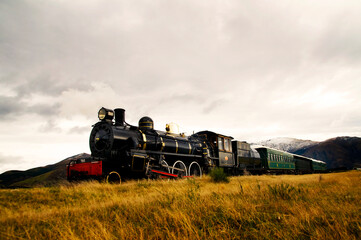 Fototapeta na wymiar Steam train in a open countryside.