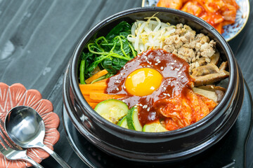 Korean spicy salad with rice traditionally Korean food, Bibimbap mixed rice with meat and assorted vegetables.