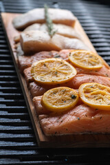 Uncooked salmon fillet on a gas grill. Recipes for grilling.