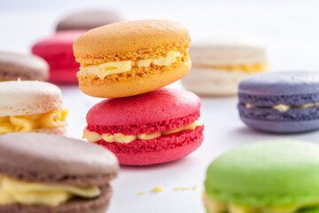 many macaroons on white table