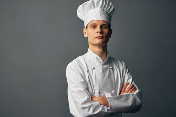 professional chef in uniform restaurant dark background