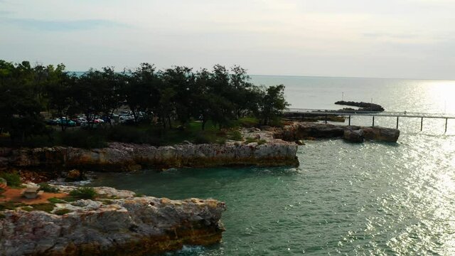 Nightcliff Jetty Surrounded With Rocky Seashore In Darwin City, Northern Territory, Australia. aerial 