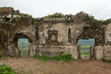 Walls of Hatgad fort in ruins, Nashik, Maharashtra, India.