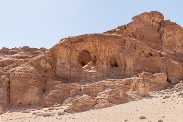 Fototapeta na wymiar Fantastic rock - Arch - formed as a result of centuries-old washing out of rocks by groundwater in Timna National Park near Eilat, southern Israel.