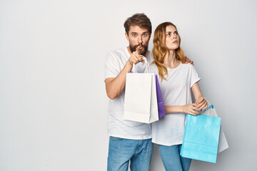 man and woman with packages in hands shopping emotions