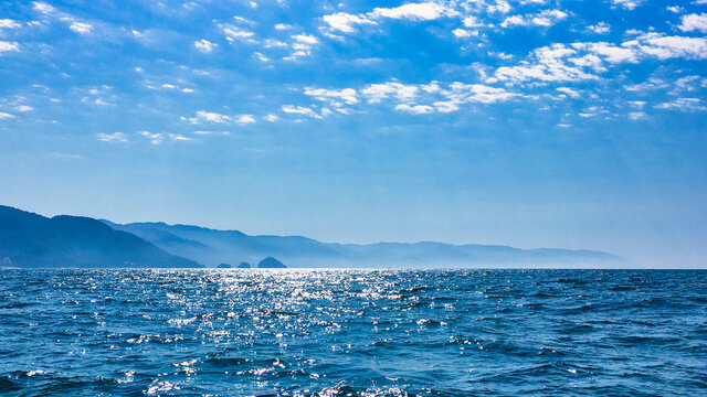peaceful pacific ocean with puerto vallarta mountains