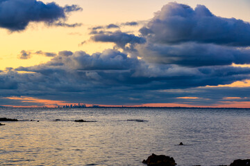 Sunset over port Phillip bay over Melbourne from far away