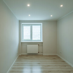 Modern light interior of empty renovated room with white walls. Heating battery under window. New apartment.