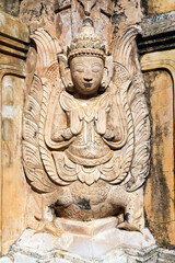 Fototapeta na wymiar Myanmar. Nyaung Shwe. The Sankar Lake. Temple of Takhaung Mwetaw. Detail of statue