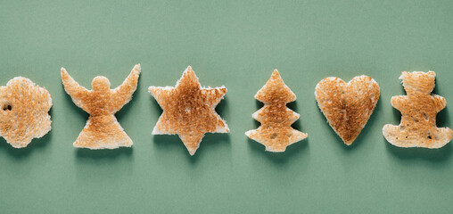 Creative Christmas background, toast with Christmas tree, angel, teddy bear, star