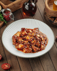 Asian chicken with sweet sauce and sesame seeds dish