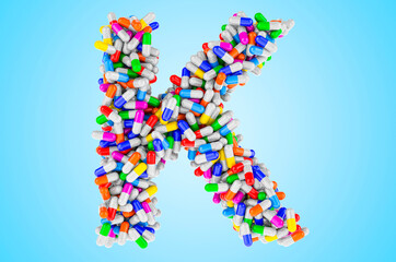 Letter K from medicine capsules, pills. 3D rendering
