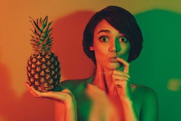 Photo of hungry excited funky amazed woman hold ananas bite finger omg face isolated neon light color background - obrazy, fototapety, plakaty