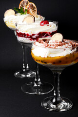 Various form of serving tiramisu with different fillings - chocolate, coconut, passion fruit, cherry and lemon.