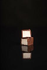 Bird's milk on a black candy cane background