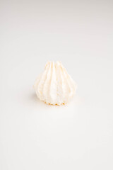 Fototapeta na wymiar Airy meringue dessert on white background