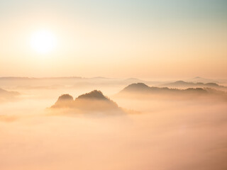 Fototapeta na wymiar Landscape misty panorama. Fantastic dreamy sunrise above fairy misty valley