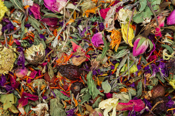 A lot of dried flowers for tea to add. Antioxidant natural herb mix. Background with dried flowers as a concept of herbal tea with aromatic ingredients.