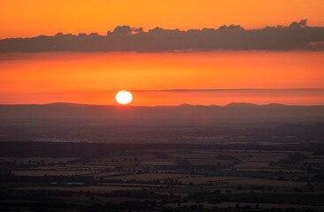 July sunset over the Shropshire Hills from the summit of the Wrekin near Telford West Midlands, England