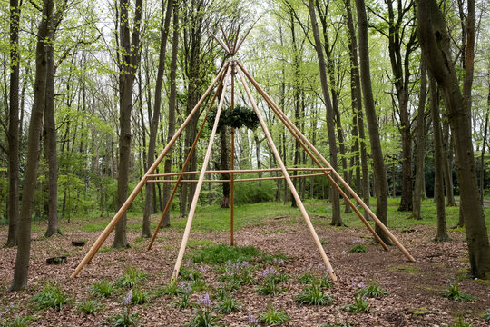 Wooden structure with wreath for a woodland naming ceremony.