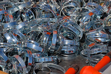 Metal hose clamps pile