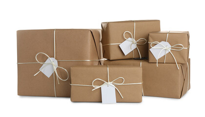 Parcels wrapped in kraft paper with tags on white background