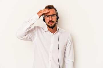 Young caucasian telemarketer man with tattoos isolated on white background  being shocked, she has remembered important meeting.