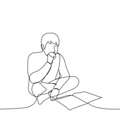man is sitting on a bed or on the floor chatting a book (lectures) - one line drawing. concept student is preparing for the exam, applicant is preparing for admission, book lover is reading