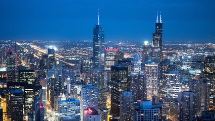 Fototapeta na wymiar Skyscrapers of Chicago by night - aerial view - CHICAGO, ILLINOIS - JUNE 12, 2019
