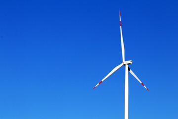 wind turbine against blue sky