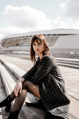 A girl on the background of a city business center