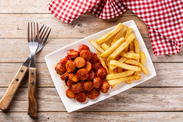 Traditional German currywurst on wooden table