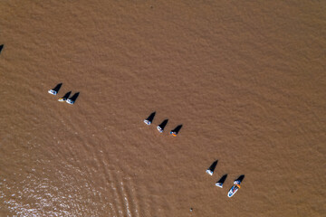 Aerial view of optimist boats, special boats for children. navigating the river.