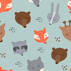 Seamless pattern with cute forest animals including bear, wolf, deer, hare, fox and raccoon. hand-drawn doodles of animal faces and heads.
