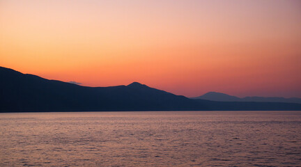 Island of Cres at sunset from the Adriatic sea in Croatia