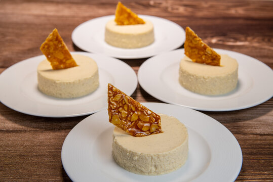 Bavarian recipe with pear and vanilla served with almond nougatine. High quality photo