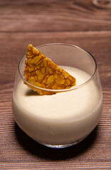 Bavarian recipe with pear and vanilla served with almond nougatine. High quality photo