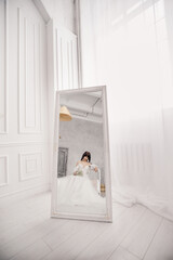 Reflection of the bride in the mirror