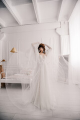 Fototapeta na wymiar The bride in a white wedding dress