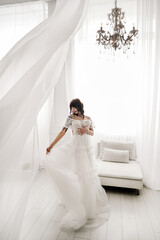 Obraz premium The bride is a girl trying on a wedding dress