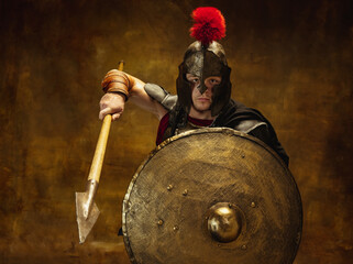 Close up of medieval person, brutal man, warrior or knight in war equipment isolated on vintage...