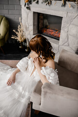 A girl in the image of a bride in a white soho style dress